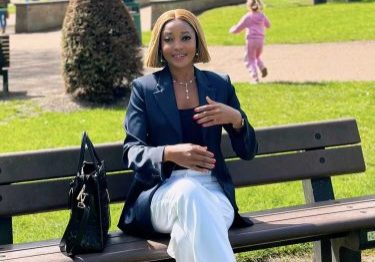 Eso, is in a park, sat on a bench